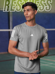 URBAN WOLFS men's grey dry-fit gym tee on male model in indoor court with white sleeve stripes