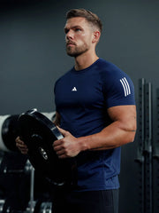 URBAN WOLFS men's navy mesh dry-fit t-shirt breathable fitted tee worn by muscular man lifting weight in gym