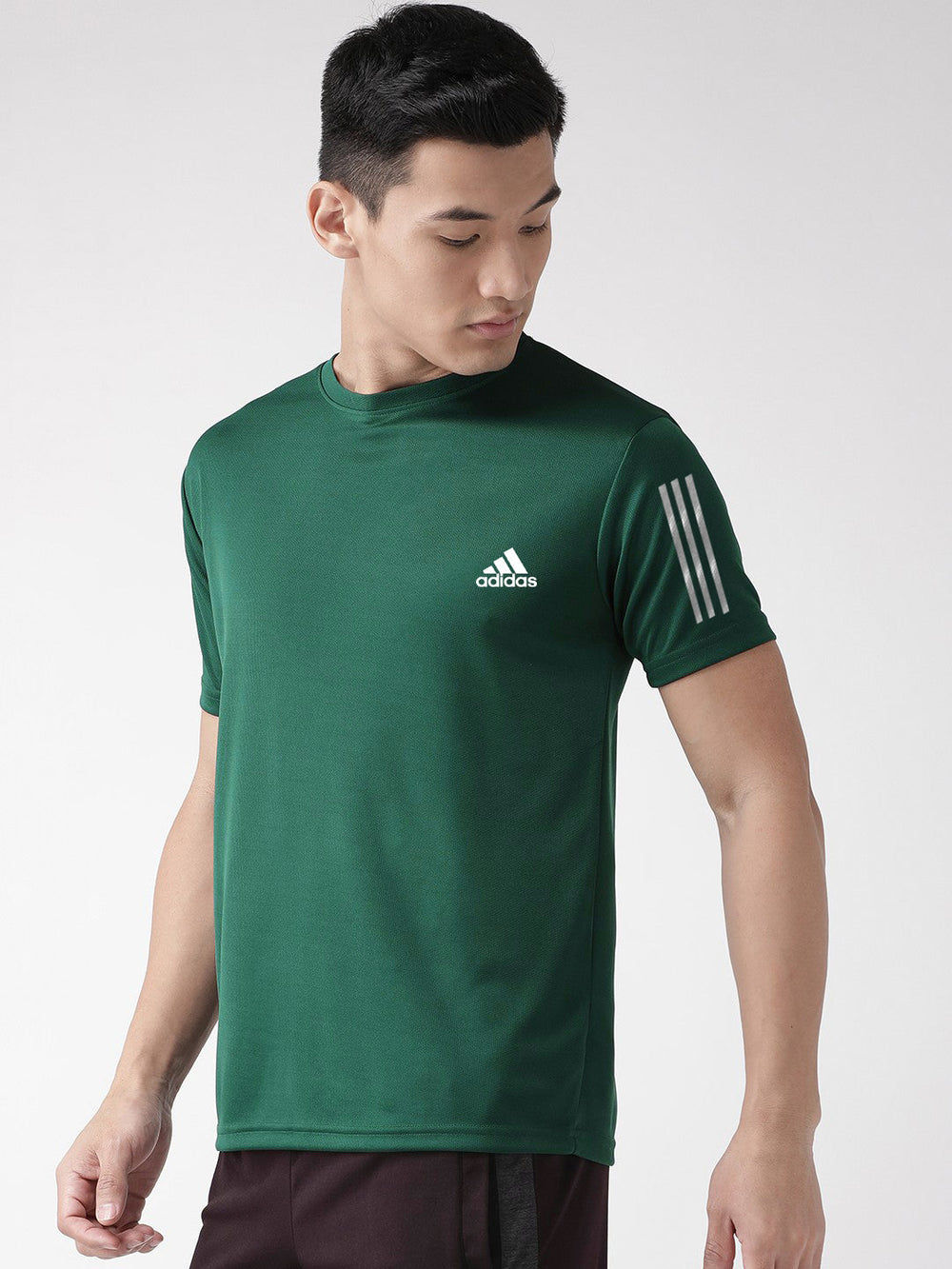 Green athletic men's dry fit premium t shirt on male model short sleeve moisture wicking performance tee